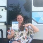 Woman holding RV gas alarm replacement