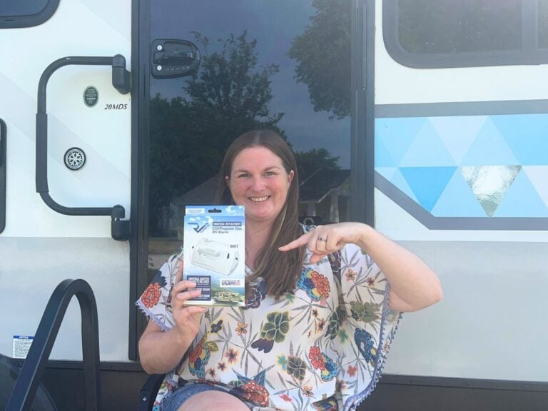 Woman holding RV gas alarm replacement