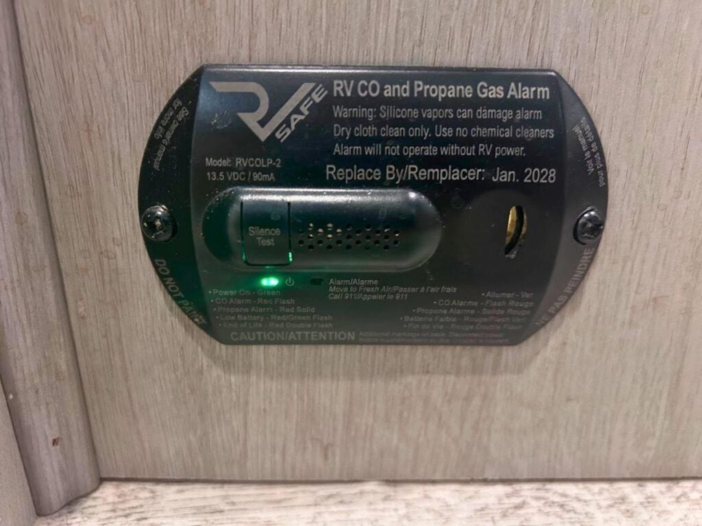 RV gas alarm mounted on wall.