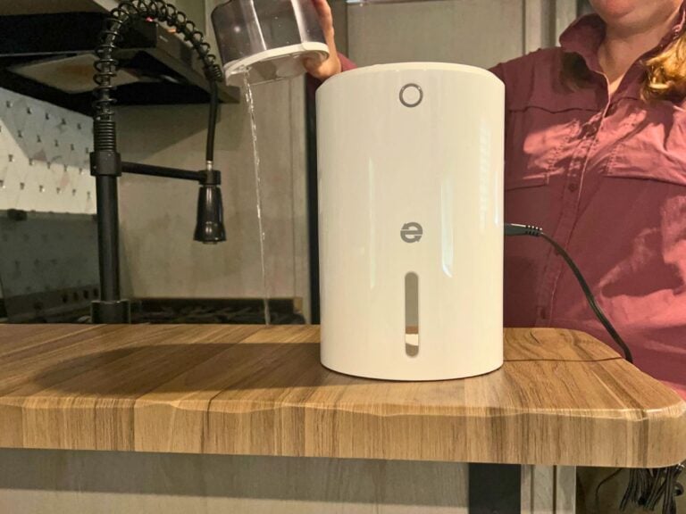 Women emptying RV dehumidifier